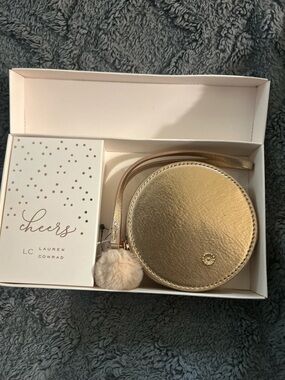 LC Lauren Conrad Gold Round Wristlet with Pom Pom Charm